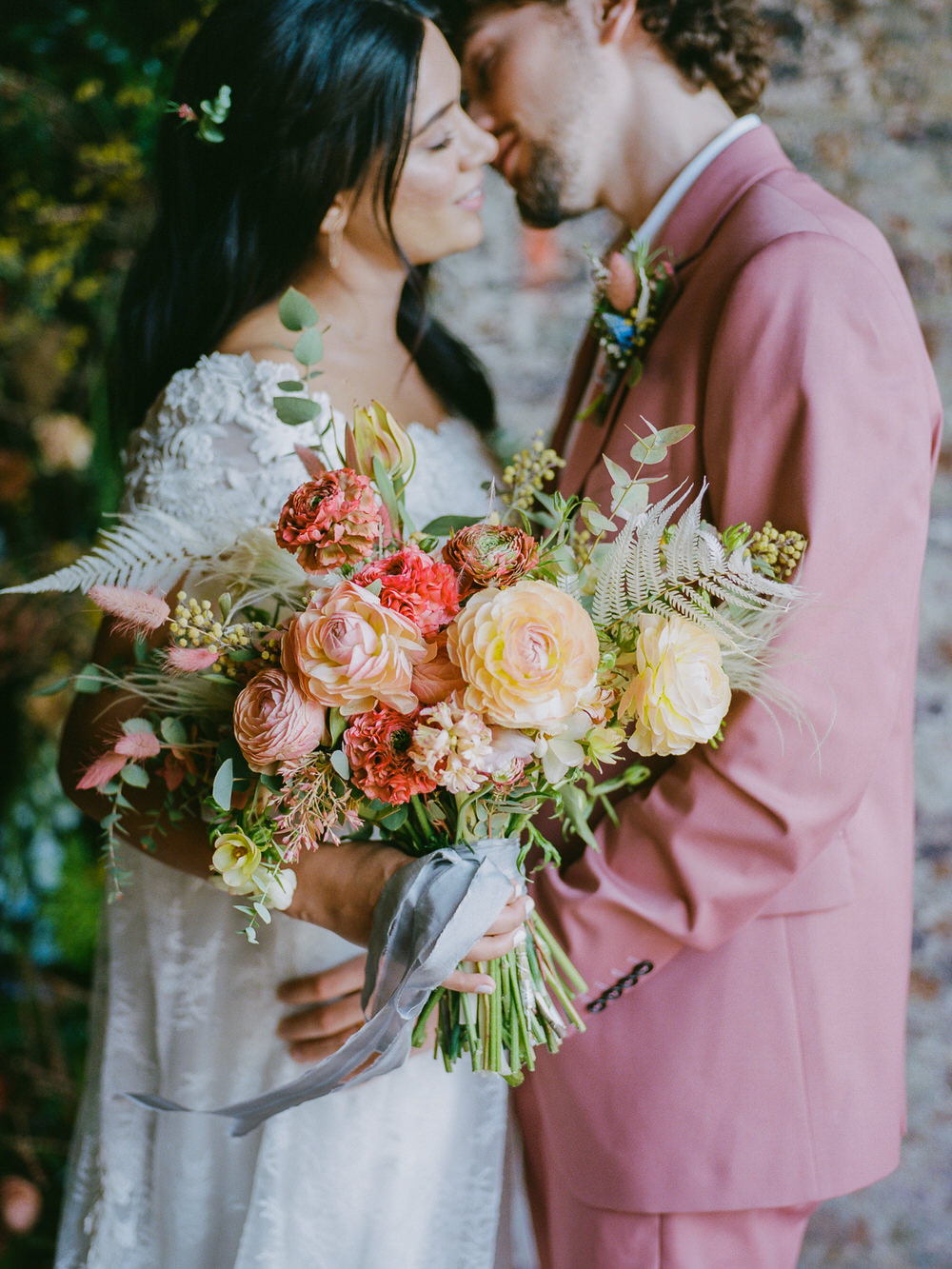 lush garden rose bouquet tied with ribbons